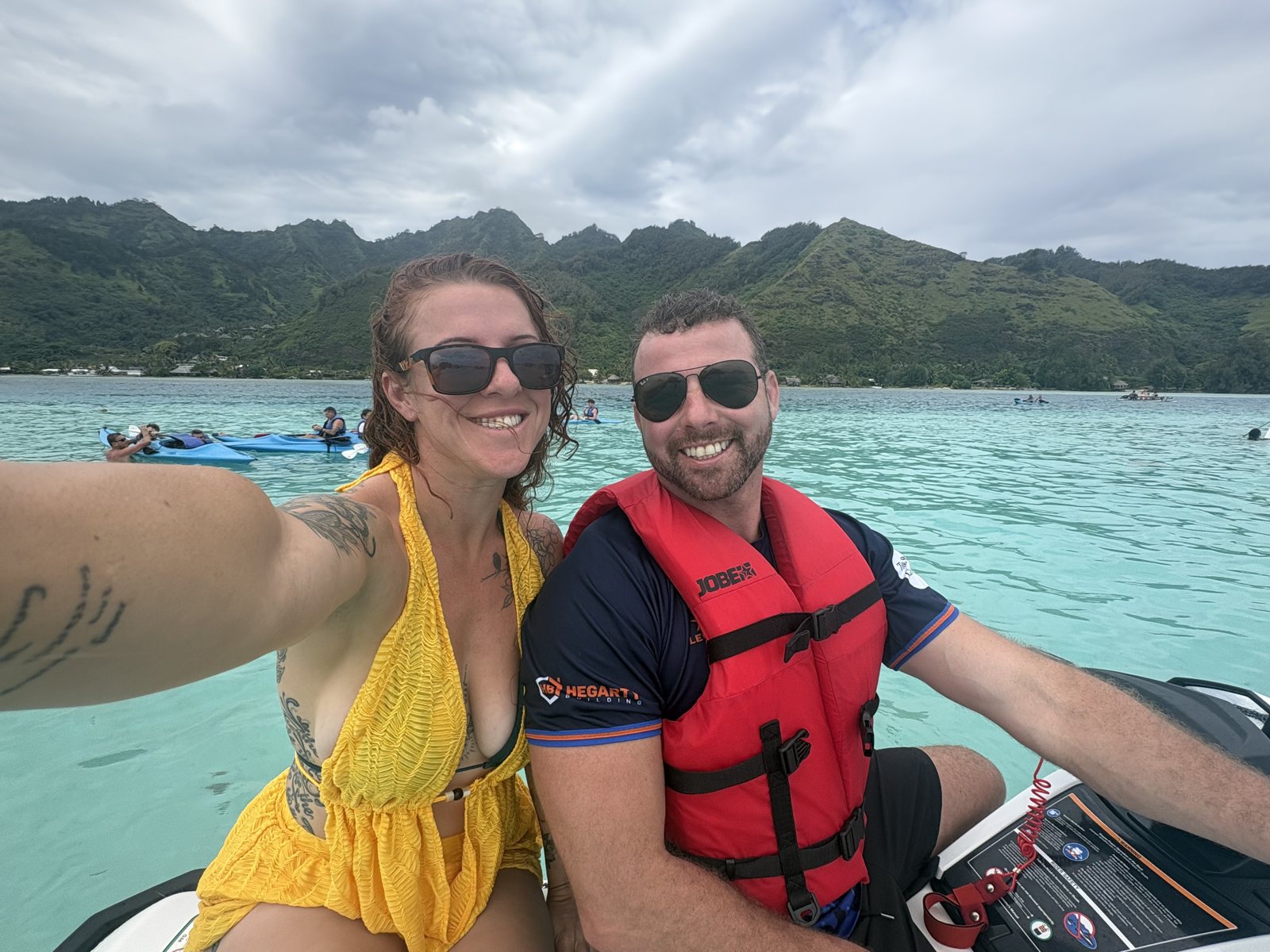 Dani and Alex on a jetski in tropical blue water