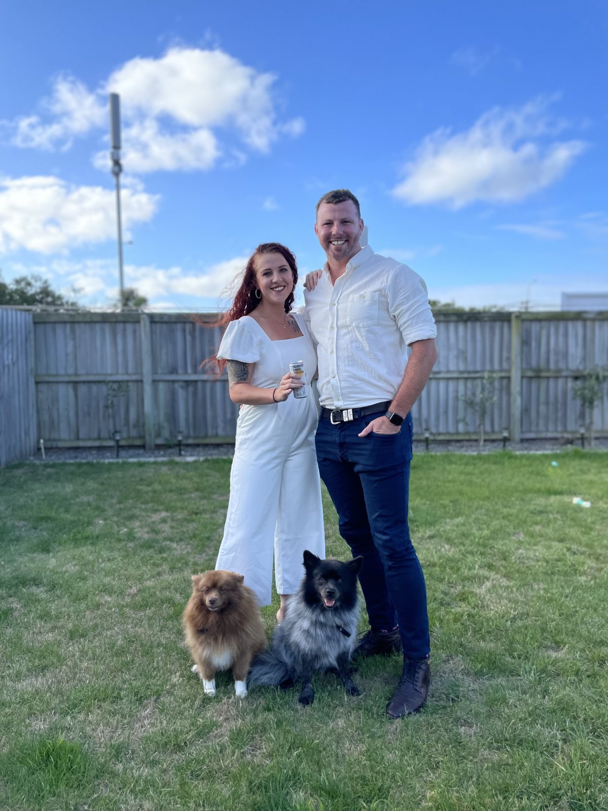 Dani and Alex in the garden with their dogs